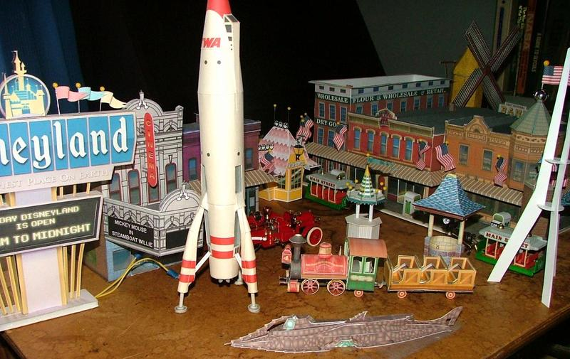 Photograph of a model version of Disneyland, featuring a model train and rocketship